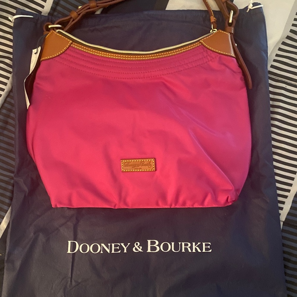 Pink Dooney & Burke bag. Brand new with tag & dust bag.